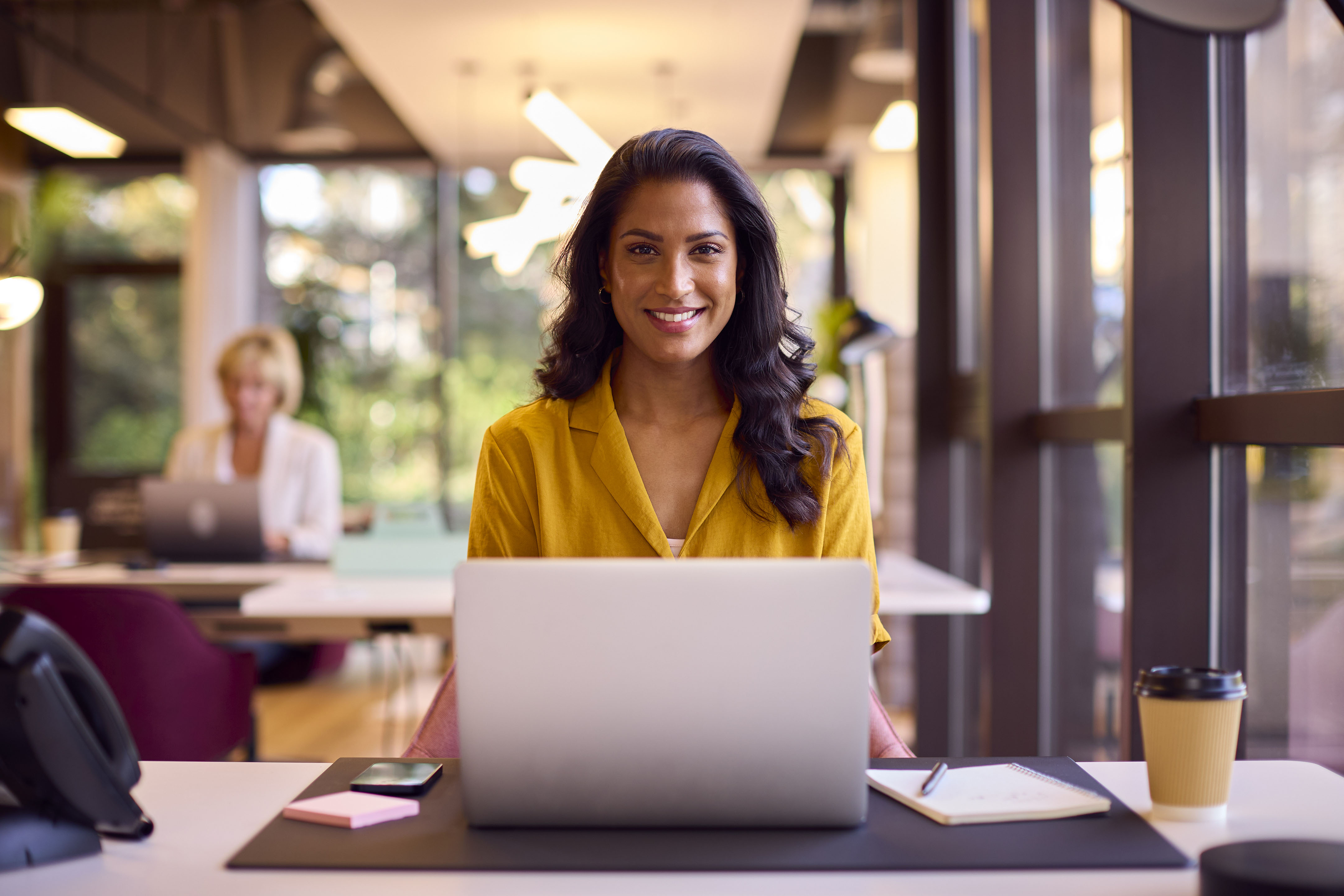 Portrait of mature businesswoman working on laptop